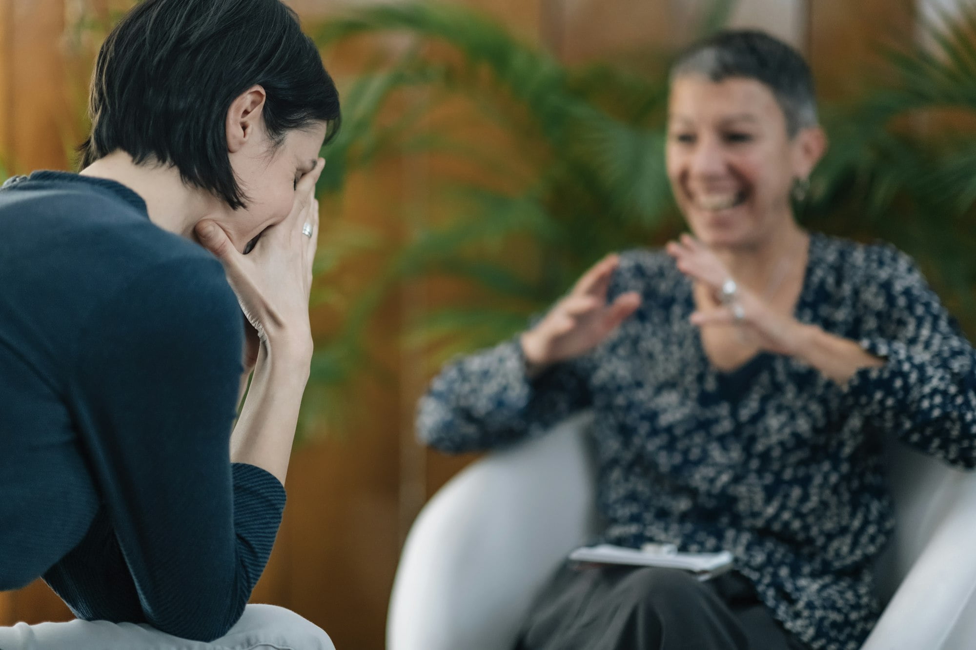 NLP or Neuro-Linguistic Programming Practitioner Having a Conversation with a Client